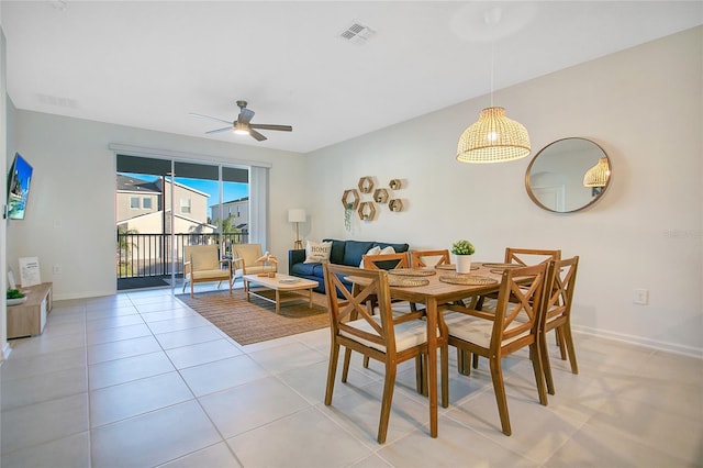 dining room featuring ceiling fan and light tile patterned floors