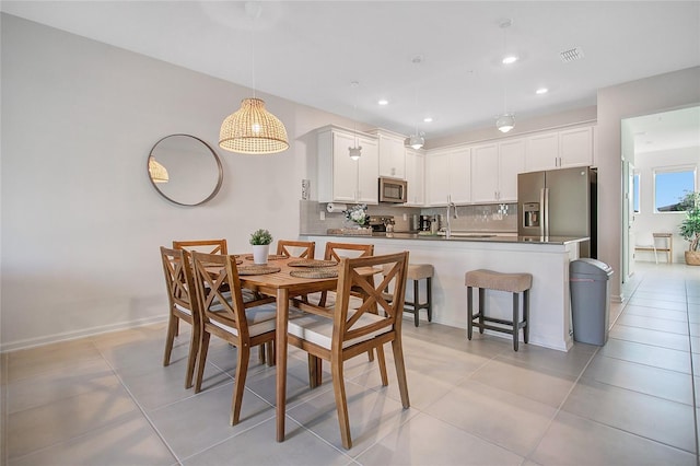 tiled dining area with sink