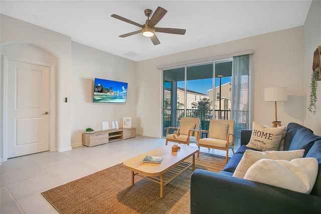 living room with light tile patterned floors and ceiling fan