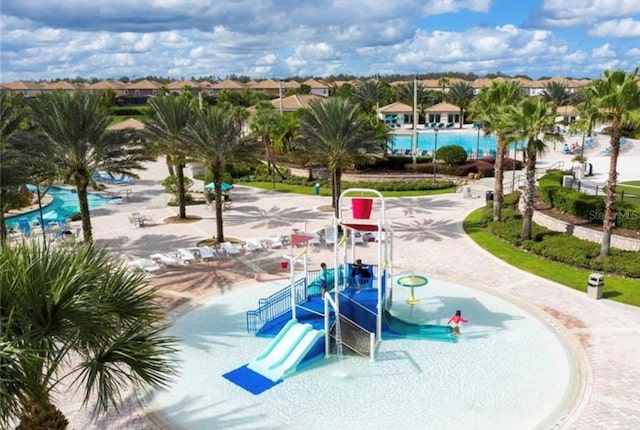 view of home's community featuring a playground