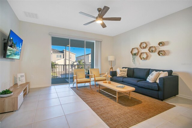 tiled living room featuring ceiling fan