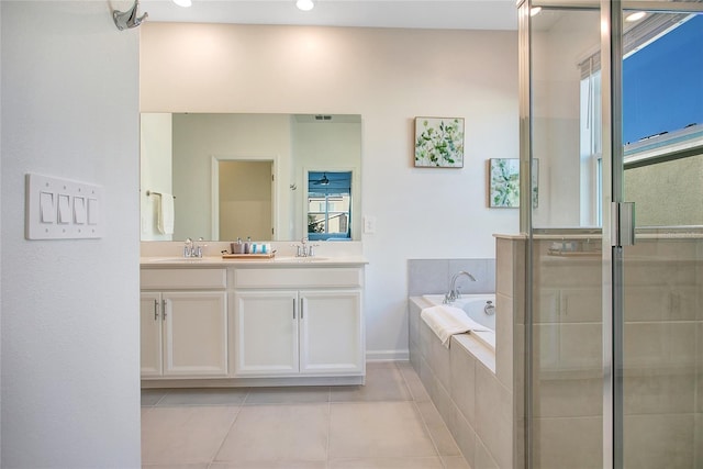 bathroom featuring tile patterned floors, plus walk in shower, and vanity