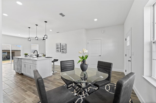 dining area featuring sink