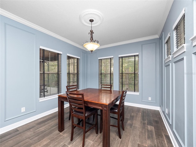 dining space featuring ornamental molding and dark hardwood / wood-style flooring