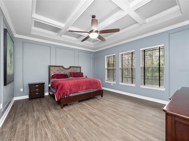 bedroom with ceiling fan, ornamental molding, and coffered ceiling