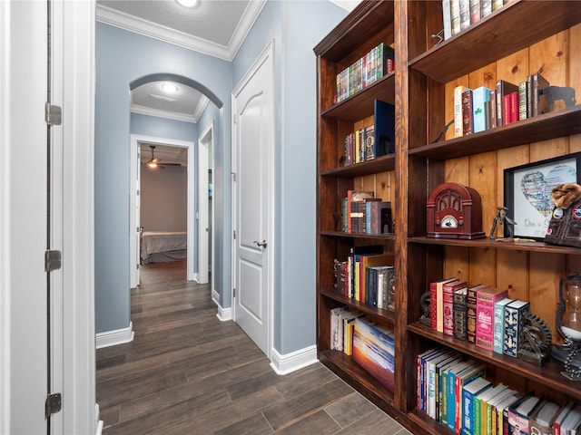 hall with ornamental molding and dark hardwood / wood-style flooring