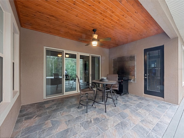 view of patio / terrace featuring ceiling fan