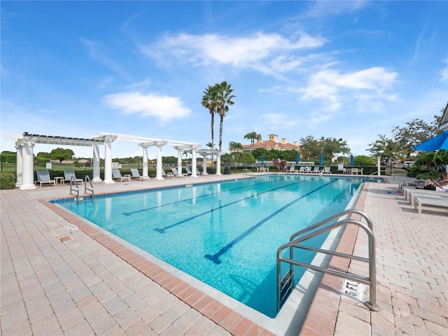 view of pool with a pergola and a patio area