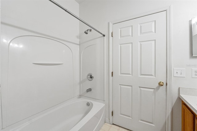 bathroom with washtub / shower combination and vanity