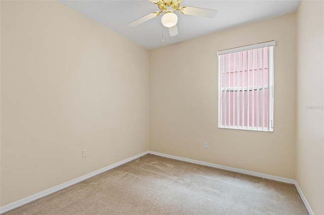 unfurnished room with carpet flooring and ceiling fan