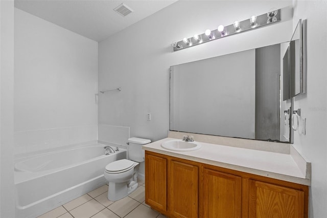 bathroom featuring tile patterned flooring, a bath, vanity, and toilet