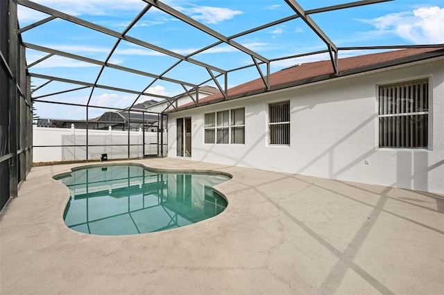 view of pool with a lanai and a patio area