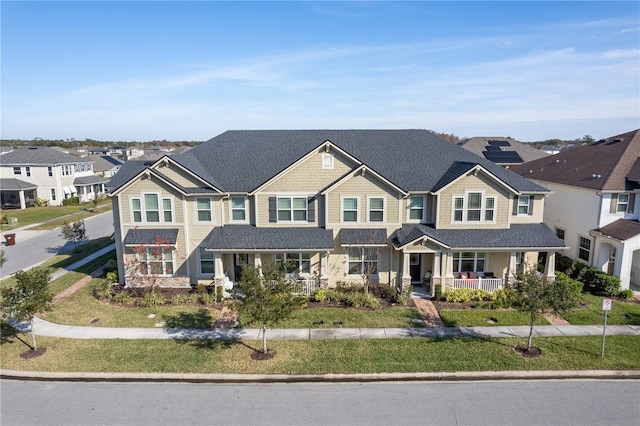 view of front of home featuring a front lawn and covered porch