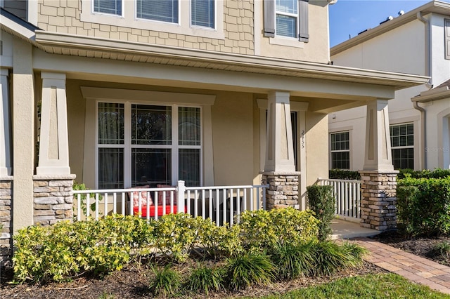 entrance to property featuring covered porch