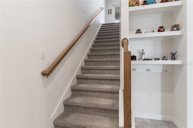 stairway with tile patterned flooring