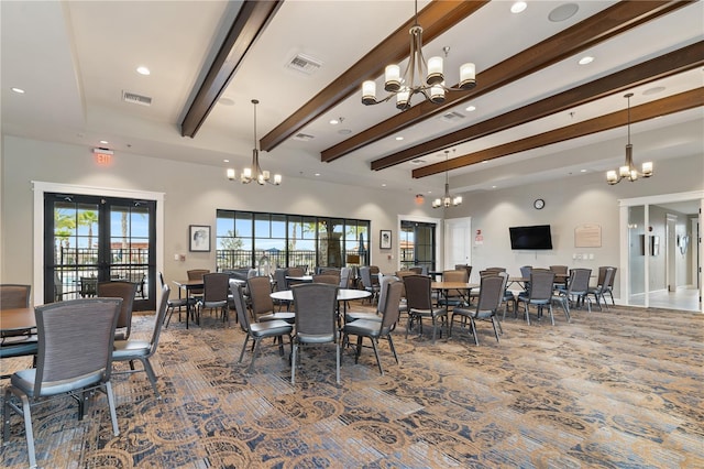 dining room with beam ceiling, a notable chandelier, dark carpet, and french doors