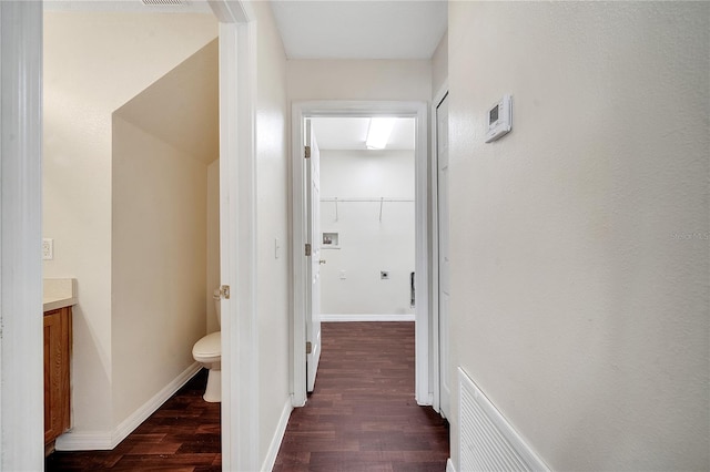 hall with dark hardwood / wood-style floors