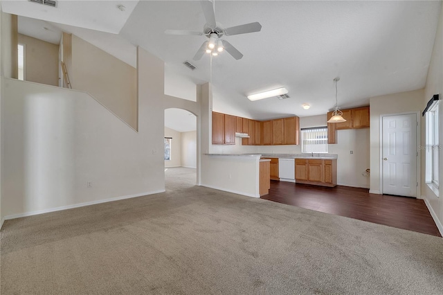 kitchen with sink, decorative light fixtures, dishwasher, dark carpet, and ceiling fan