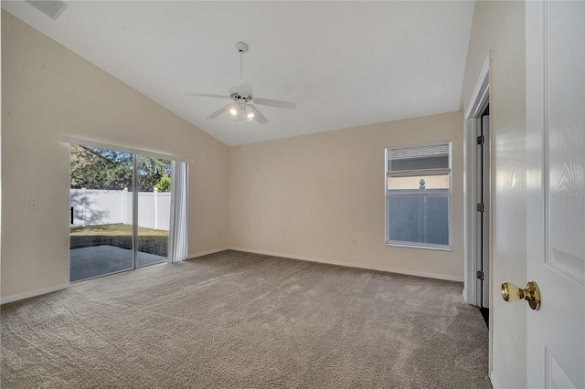 spare room with lofted ceiling, carpet floors, and ceiling fan