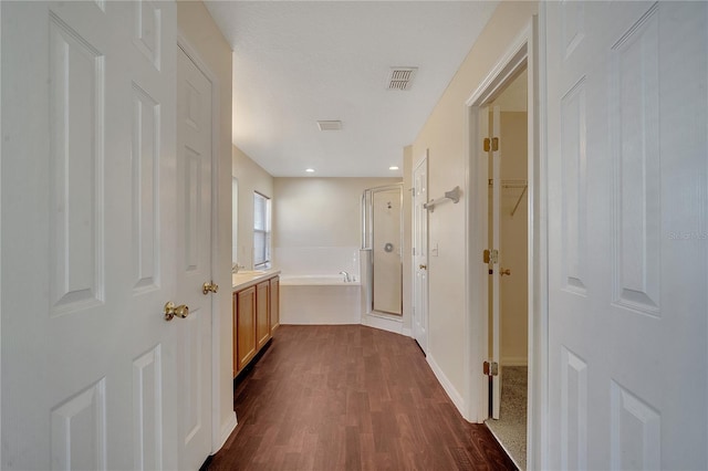 corridor featuring dark hardwood / wood-style floors