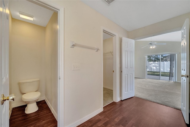 bathroom featuring hardwood / wood-style floors, ceiling fan, and toilet