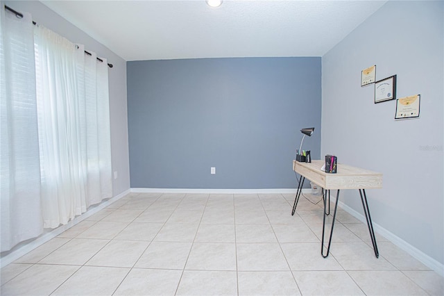 home office with light tile patterned floors