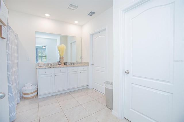 bathroom featuring vanity and tile patterned flooring