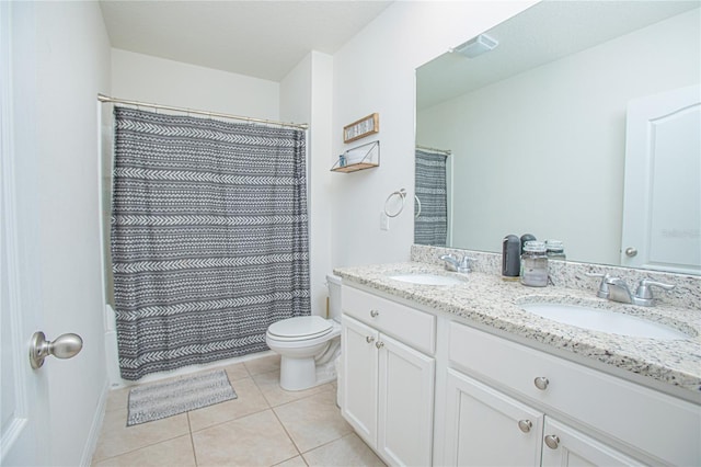 bathroom with vanity, tile patterned flooring, a shower with curtain, and toilet