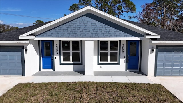 ranch-style home with a garage, a front lawn, and a porch