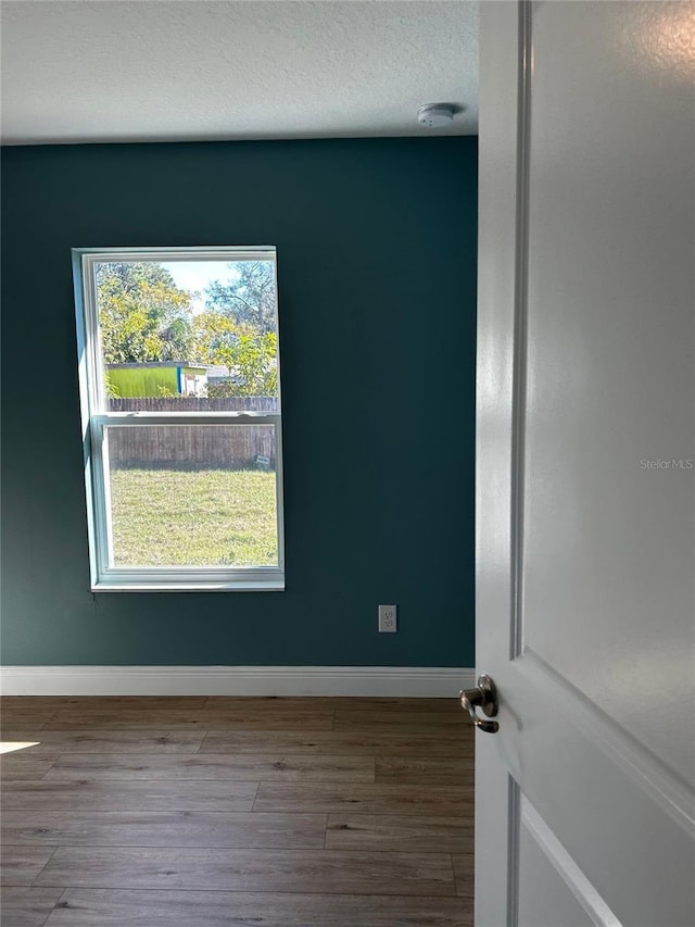 empty room featuring hardwood / wood-style flooring