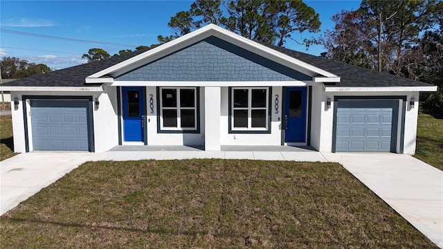 ranch-style house featuring a porch, a garage, and a front lawn