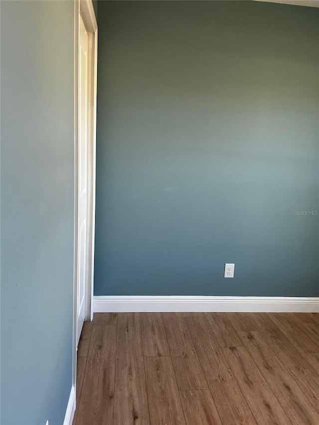 spare room with light wood-type flooring