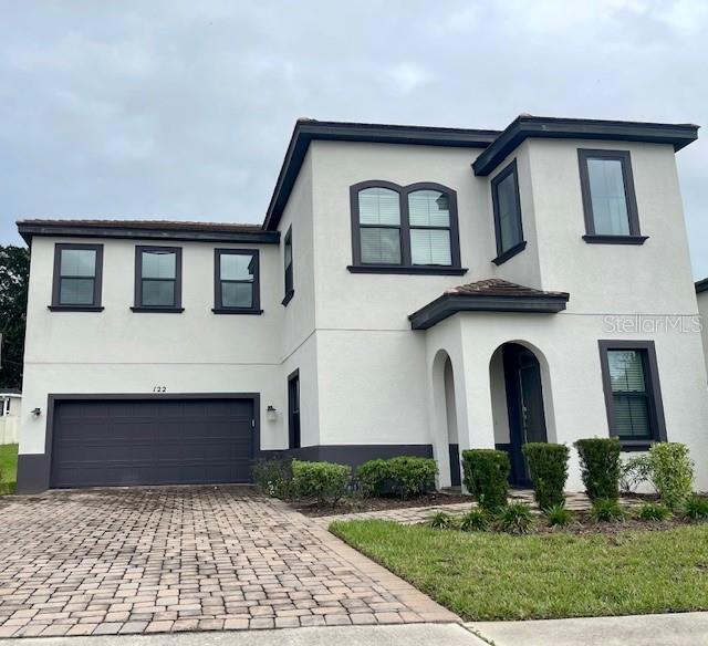 view of front of property with a garage