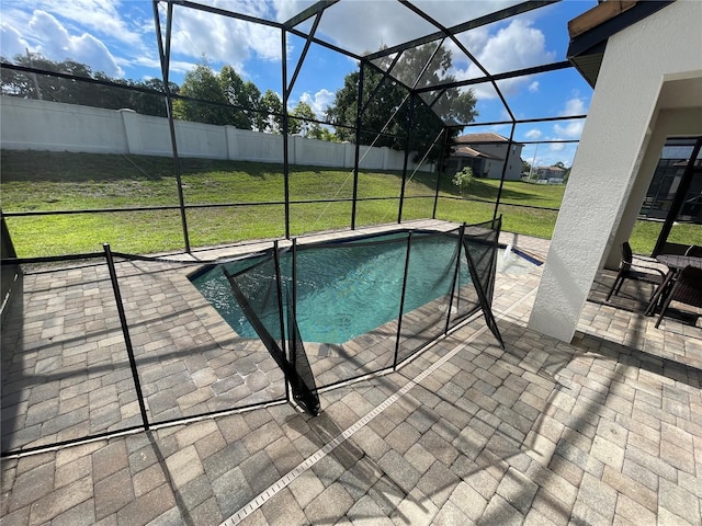 view of pool featuring a yard, a patio, and a lanai