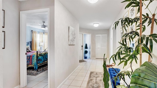 hallway with light tile patterned floors