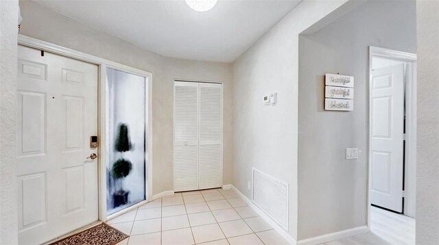 view of tiled foyer entrance