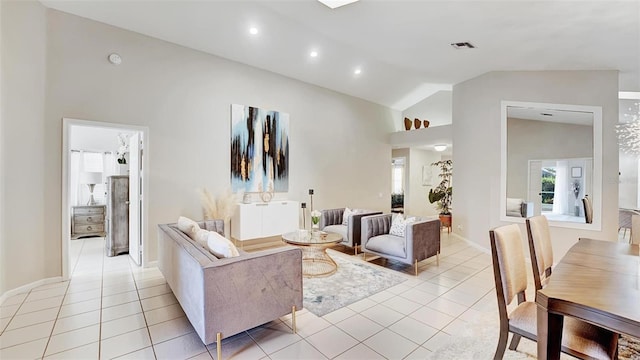 living room featuring lofted ceiling and light tile patterned floors