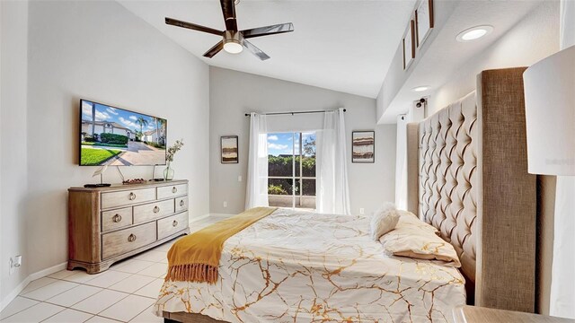 bedroom with ceiling fan, vaulted ceiling, and light tile patterned floors