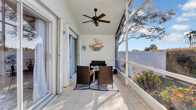 sunroom with lofted ceiling and ceiling fan