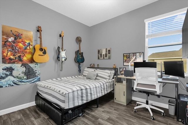 bedroom with dark hardwood / wood-style floors