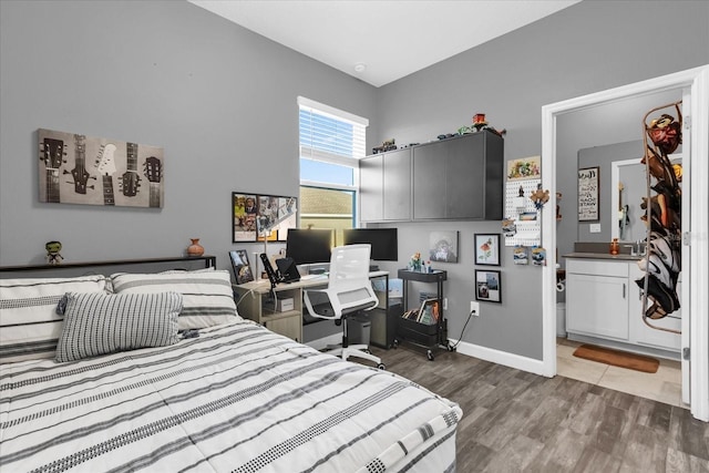 bedroom with wood-type flooring