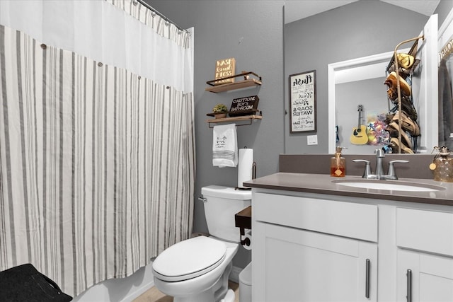 full bathroom featuring vanity, toilet, and shower / bath combo with shower curtain