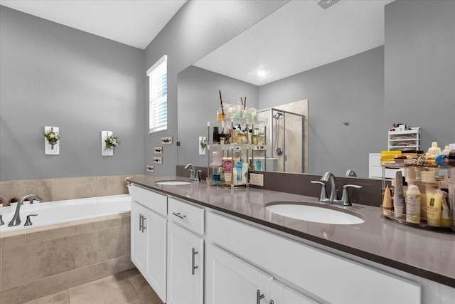 bathroom with vanity, tile patterned floors, and independent shower and bath