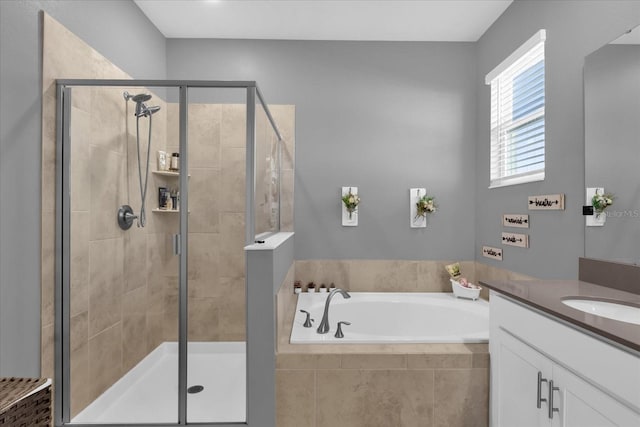 bathroom featuring vanity and shower with separate bathtub