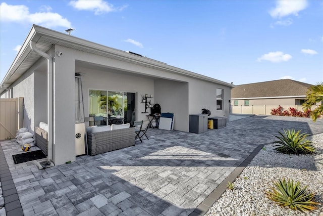 rear view of house with a patio