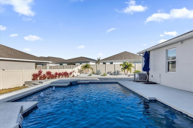 view of swimming pool featuring central AC