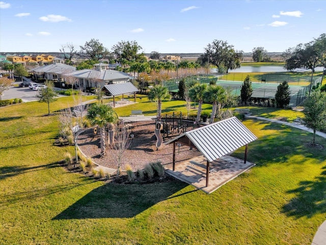 view of community featuring a gazebo, a water view, and a lawn