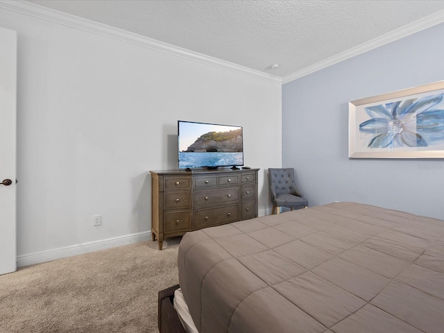 carpeted bedroom with ornamental molding and a textured ceiling