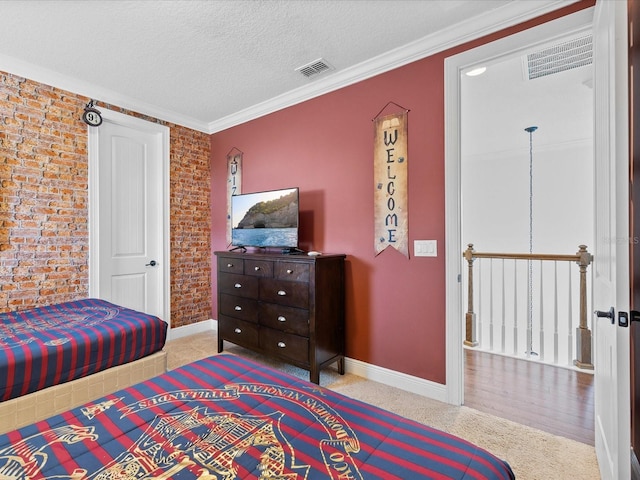 carpeted bedroom featuring ornamental molding and a textured ceiling