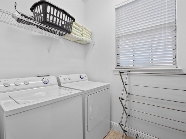 washroom featuring washer and dryer